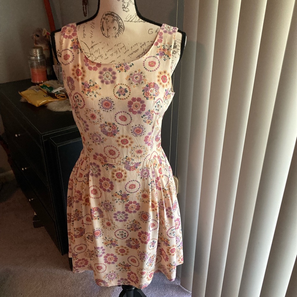 Guess dress in Rayon Size-~L. Length @30”.  NWOT